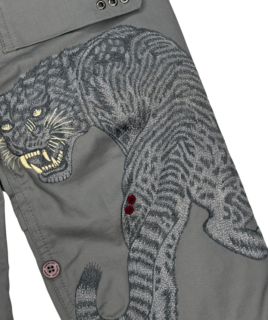 The Maharishi Kid's Tiger Snopants 5508 feature bold tiger embroidery, adjustable waistband, and durable fabric—perfect for stylish, everyday adventure.