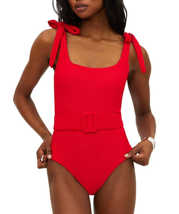 Vibrant red ribbed swimsuit featuring tie shoulder straps, removable cups, shelf bra, and optional belt. Provides a stylish, comfy fit with moderate coverage.