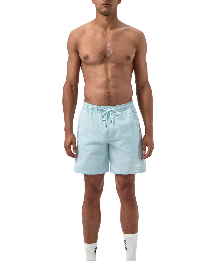 BALR Logo Swim Shorts B1451.1035 – premium swim shorts featuring an elasticated waistband with a drawcord, bold BALR branding, and two zippered pockets. Designed for comfort and style, these shorts are perfect for beach days or poolside relaxation.