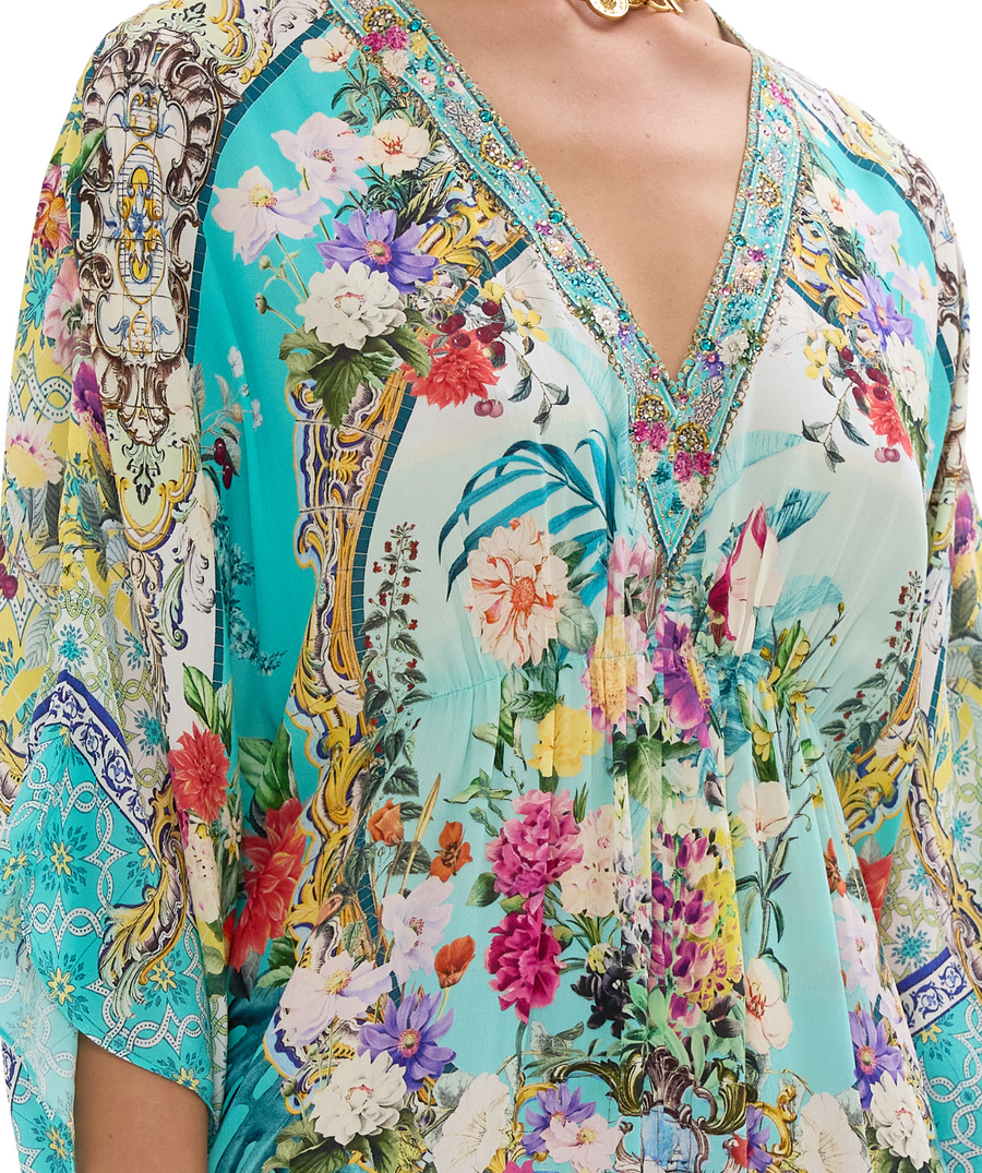 CAMILLA Gardens Of Queluz Long Kaftan 00033593 – A luxurious long kaftan showcasing an opulent garden-inspired print, flowing silhouette, and elegant crystal details.