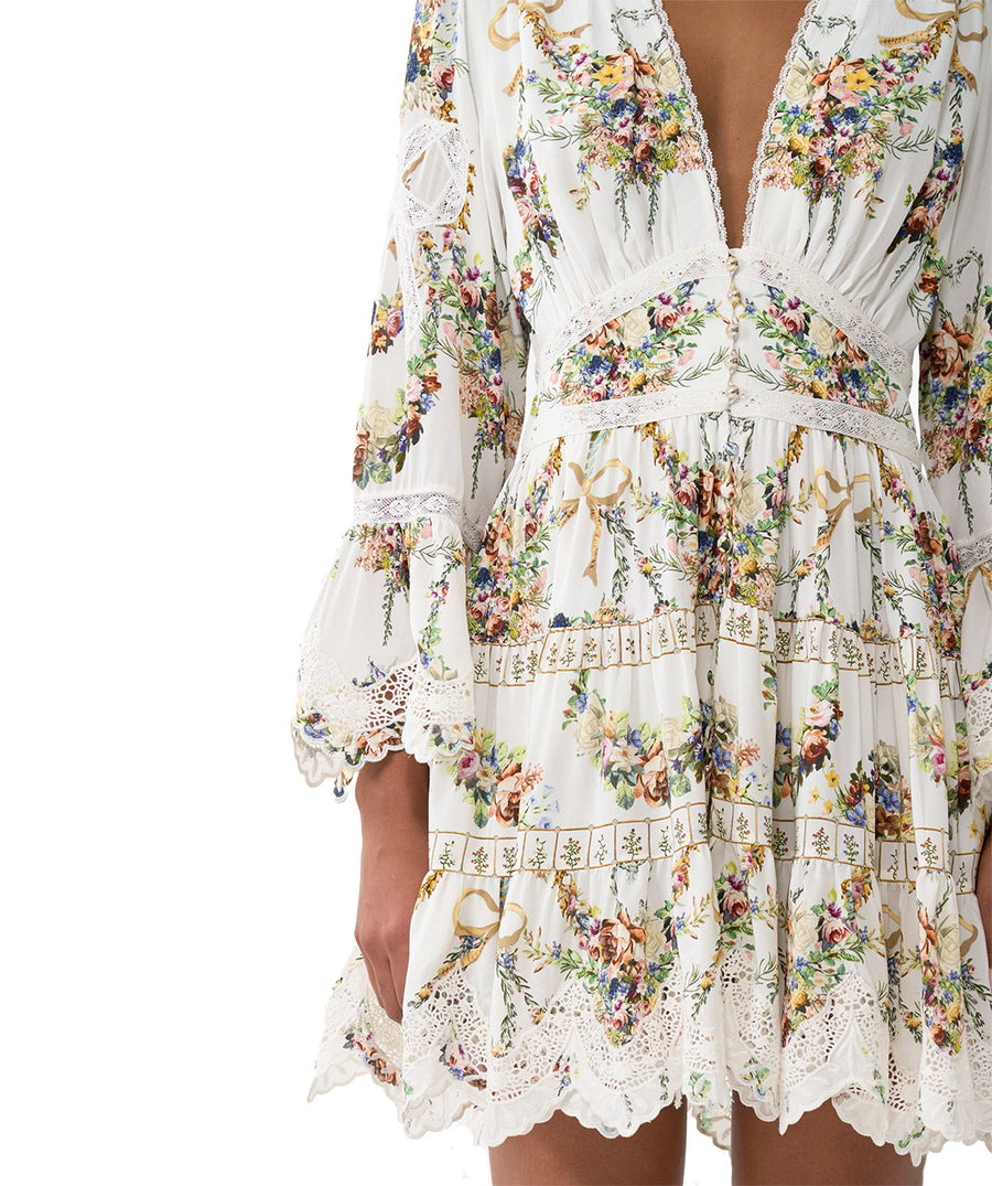 Own the spotlight in the CAMILLA Dressing Room Drama Short Dress 00034739 – a bold, theatrical print meets a flirty silhouette for standout style.