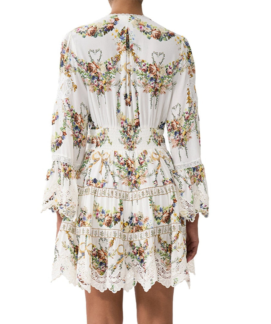 Own the spotlight in the CAMILLA Dressing Room Drama Short Dress 00034739 – a bold, theatrical print meets a flirty silhouette for standout style.