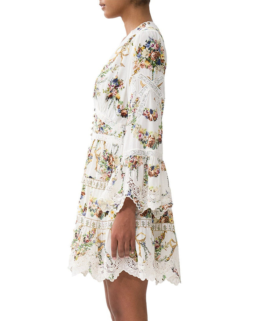 Own the spotlight in the CAMILLA Dressing Room Drama Short Dress 00034739 – a bold, theatrical print meets a flirty silhouette for standout style.