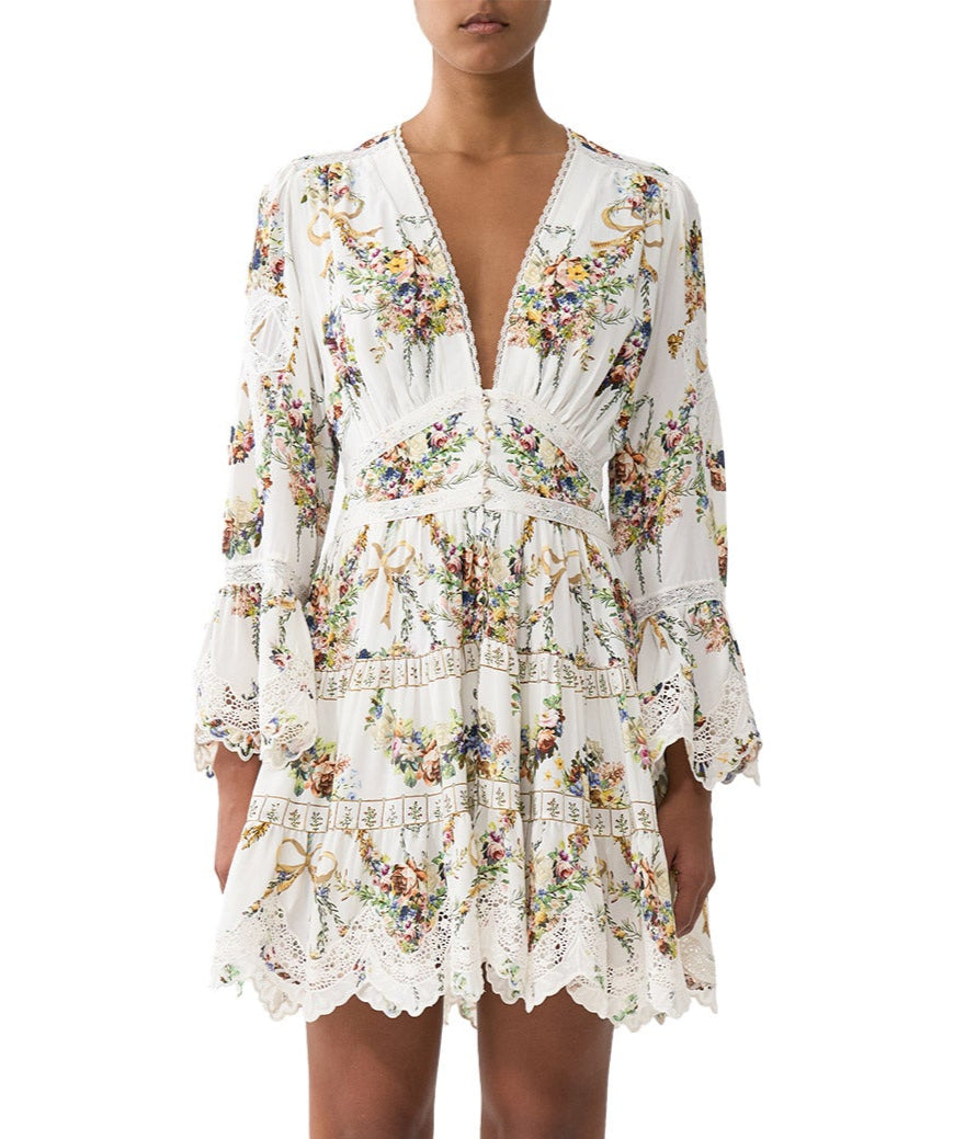 Own the spotlight in the CAMILLA Dressing Room Drama Short Dress 00034739 – a bold, theatrical print meets a flirty silhouette for standout style.