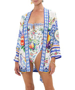 Elevate your style with the CAMILLA Tiles Darls Short Batwing Layer 00034882 – a bold printed piece with flowing sleeves for effortless boho-luxe flair.