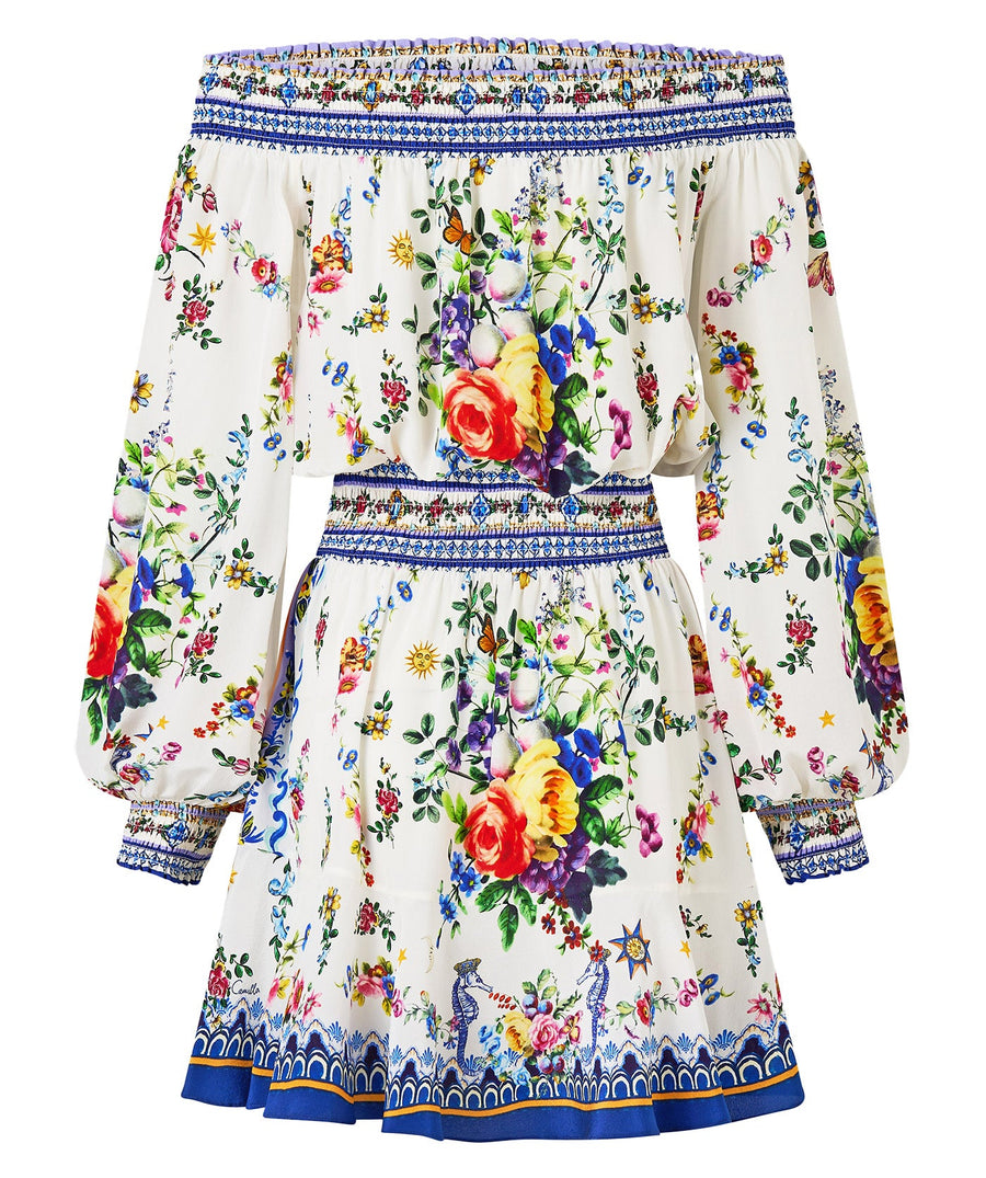 Chic and playful, the CAMILLA Tiles Darls Off Shoulder Short Dress 00035220 features bold prints and flirty ruffles—perfect for sunny days and summer nights.