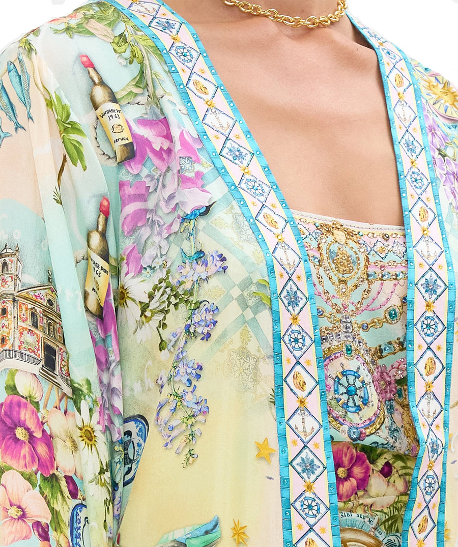 Embrace coastal charm in the CAMILLA Just Coasting Short Kimono Wrap 00035638, featuring oceanic prints, luxe silk, and a relaxed fit for effortless style.