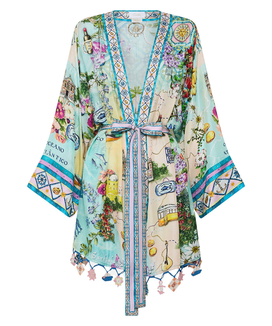 Embrace coastal charm in the CAMILLA Just Coasting Short Kimono Wrap 00035638, featuring oceanic prints, luxe silk, and a relaxed fit for effortless style.