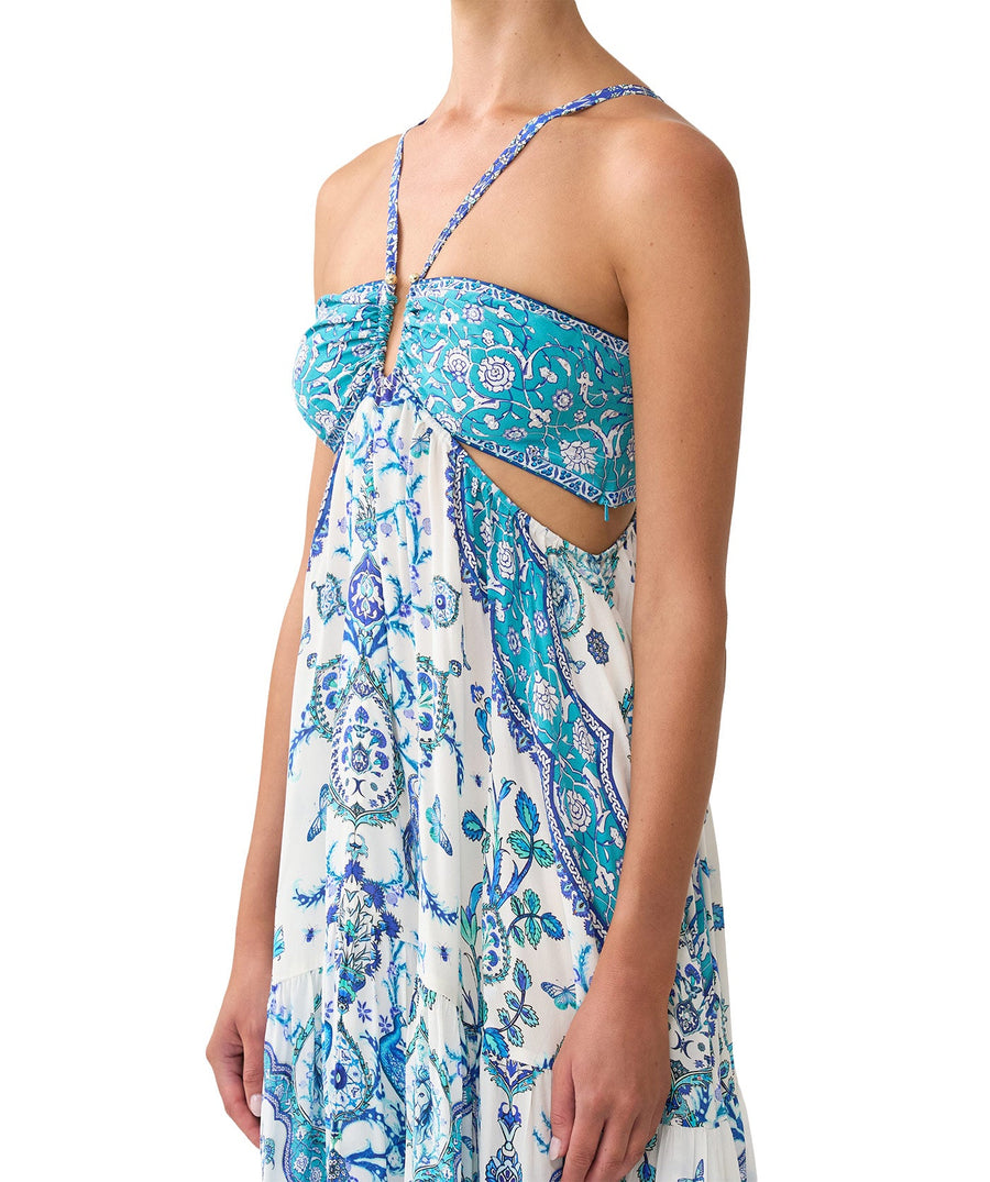 The CAMILLA Isnik Lullaby Cut Out Dress 00036545 showcases bold prints, waist cut-outs, and crystal embellishments—perfect for statement summer style.