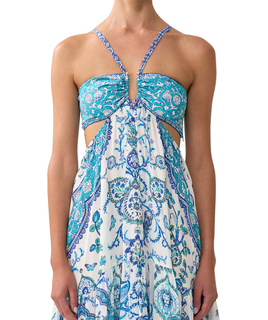The CAMILLA Isnik Lullaby Cut Out Dress 00036545 showcases bold prints, waist cut-outs, and crystal embellishments—perfect for statement summer style.