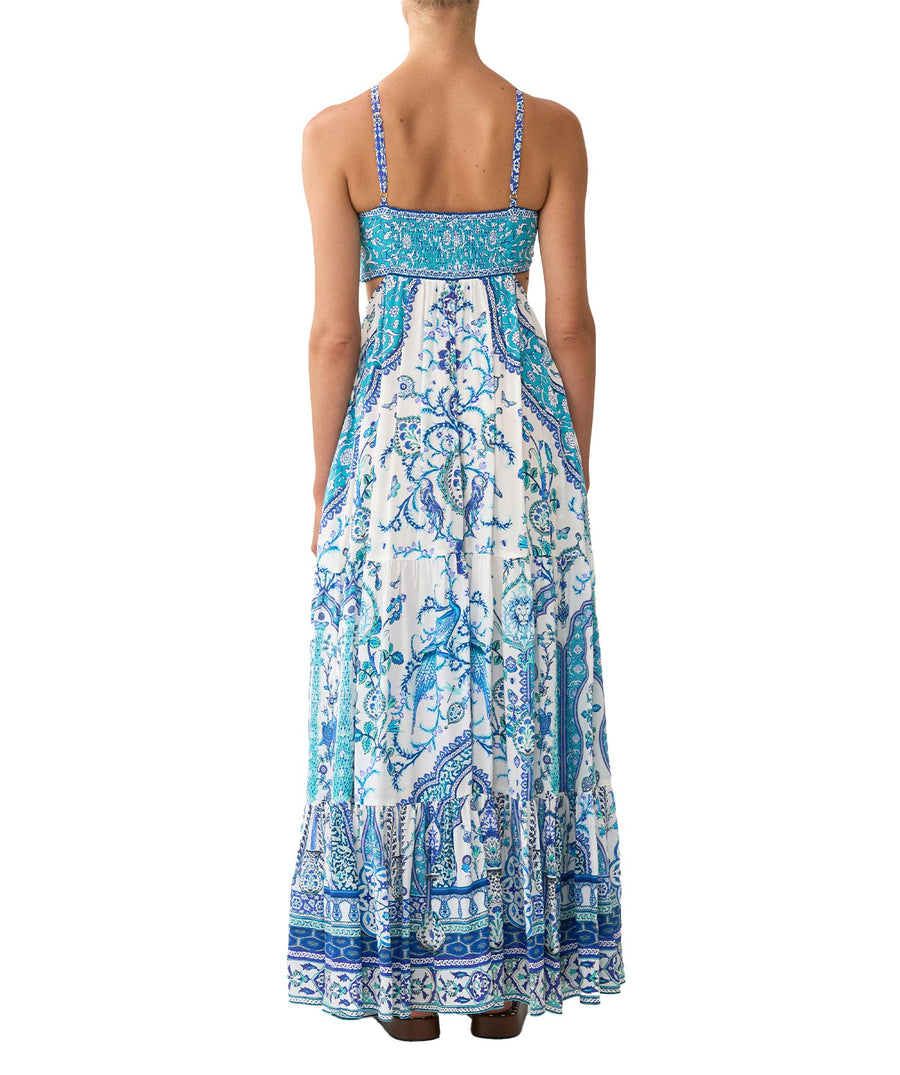 The CAMILLA Isnik Lullaby Cut Out Dress 00036545 showcases bold prints, waist cut-outs, and crystal embellishments—perfect for statement summer style.