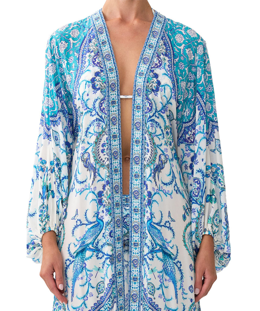 The CAMILLA Isnik Lullaby Blouson Sleeve Layer 00037270 features flowy sleeves, vibrant prints, and crystal details—perfect for luxe, effortless layering.