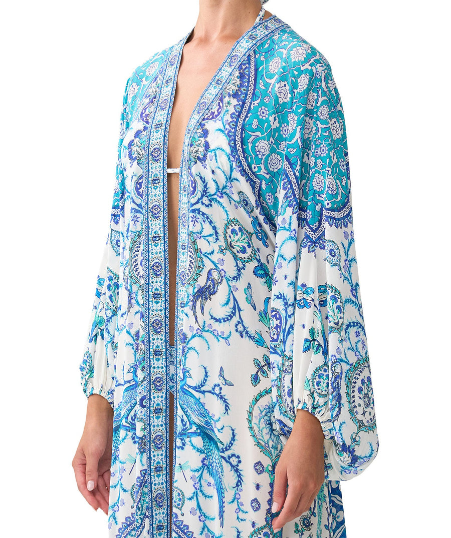 The CAMILLA Isnik Lullaby Blouson Sleeve Layer 00037270 features flowy sleeves, vibrant prints, and crystal details—perfect for luxe, effortless layering.