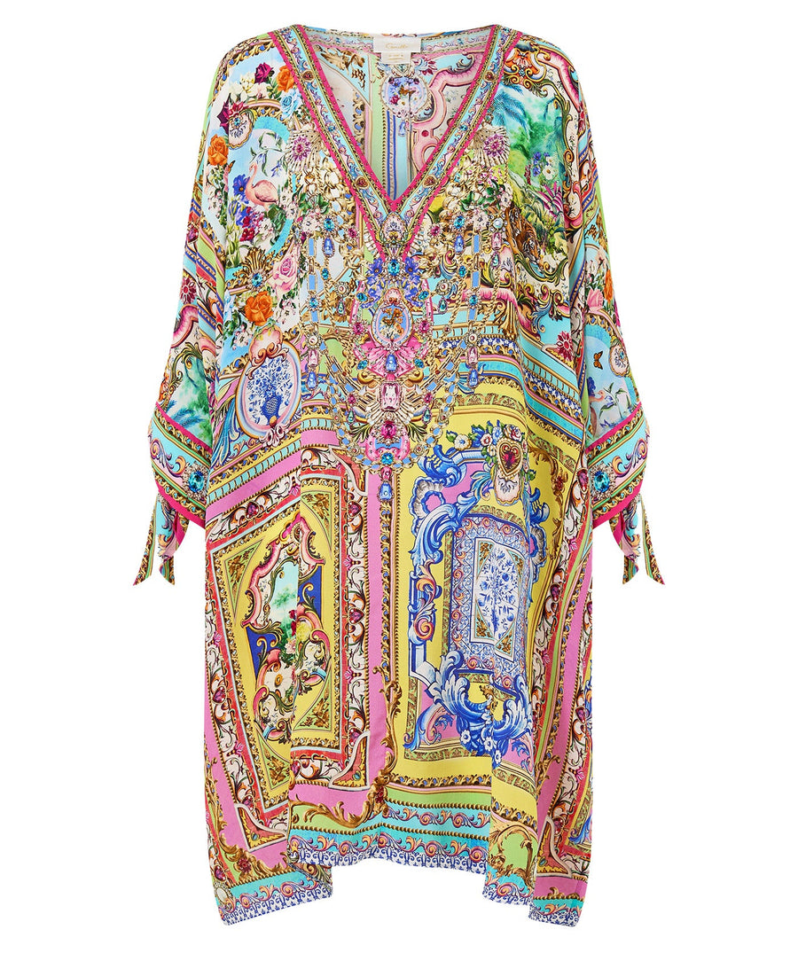 Embrace boho-luxe style with the CAMILLA Spirit Of Santa Maria Kaftan 00037784 – a flowing silhouette adorned with vibrant prints and signature detailing.