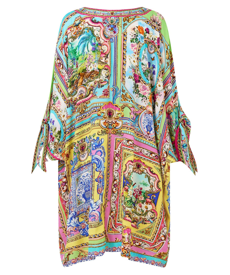 Embrace boho-luxe style with the CAMILLA Spirit Of Santa Maria Kaftan 00037784 – a flowing silhouette adorned with vibrant prints and signature detailing.