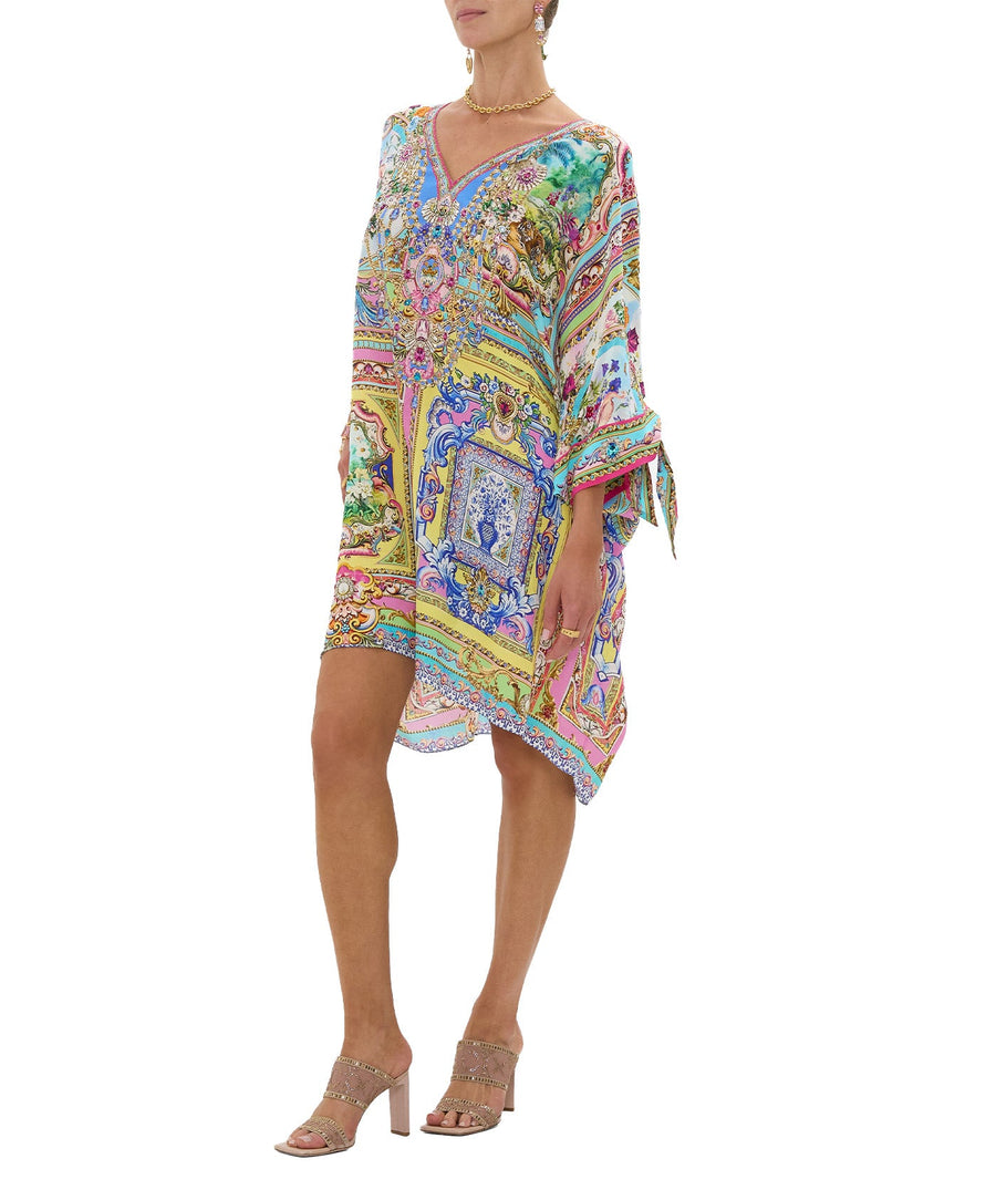 Embrace boho-luxe style with the CAMILLA Spirit Of Santa Maria Kaftan 00037784 – a flowing silhouette adorned with vibrant prints and signature detailing.