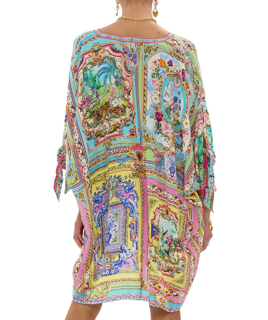 Embrace boho-luxe style with the CAMILLA Spirit Of Santa Maria Kaftan 00037784 – a flowing silhouette adorned with vibrant prints and signature detailing.
