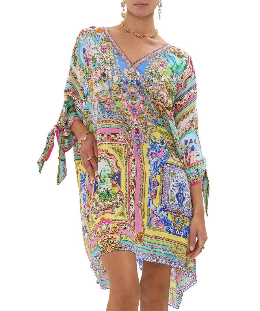 Embrace boho-luxe style with the CAMILLA Spirit Of Santa Maria Kaftan 00037784 – a flowing silhouette adorned with vibrant prints and signature detailing.