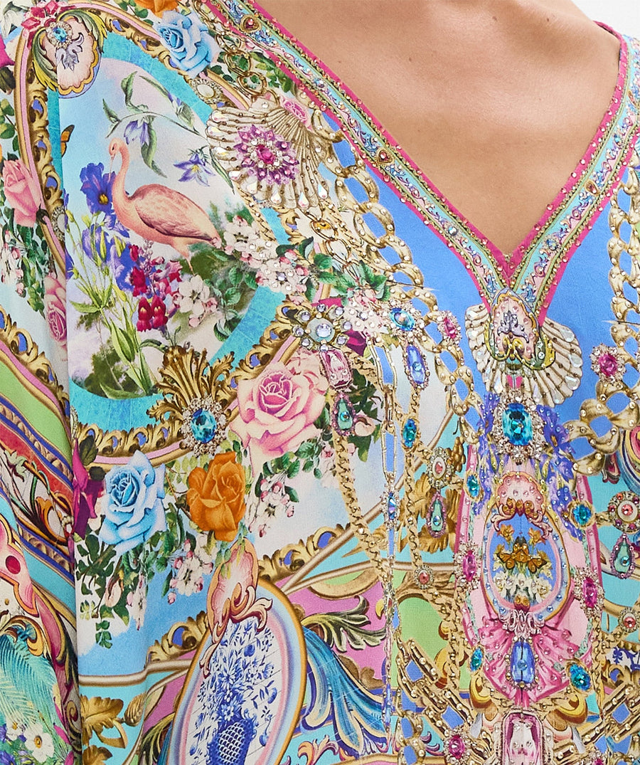 Embrace boho-luxe style with the CAMILLA Spirit Of Santa Maria Kaftan 00037784 – a flowing silhouette adorned with vibrant prints and signature detailing.