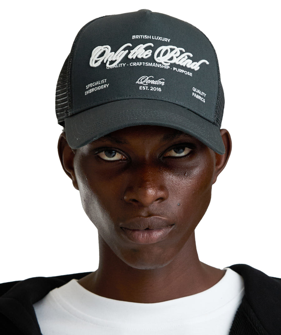 "ONLY THE BLIND Graphite Specialist Trucker Cap OTB-C1642. A premium streetwear essential with sleek design, comfort, and everyday style.