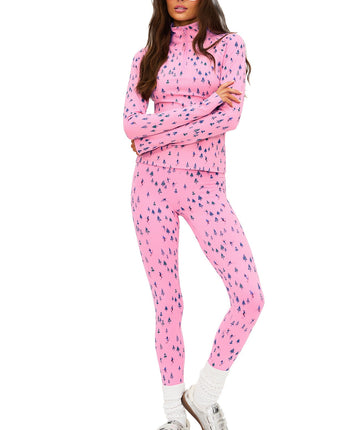 Ski Patrol print active set featuring mock-neck zip top, slim fit, thumbholes, sculpting high-rise leggings, and soft performance fabric perfect for winter workouts.