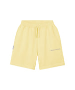 Yellow shorts with a brand logo on a white background