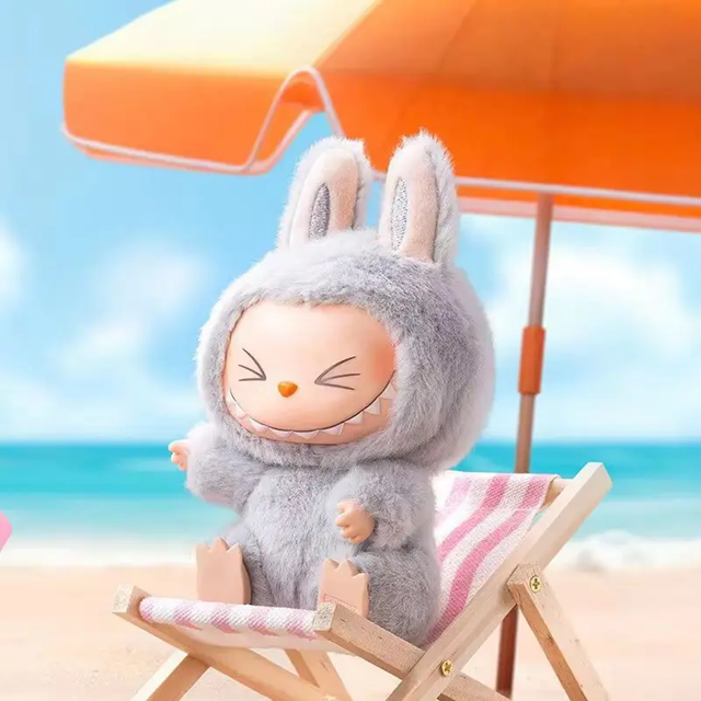 Meet LABUBU Version 2 Have A Seat K67LBUV2 – a whimsical collectible figure showcasing playful charm and detail, perfect for designer toy enthusiasts.