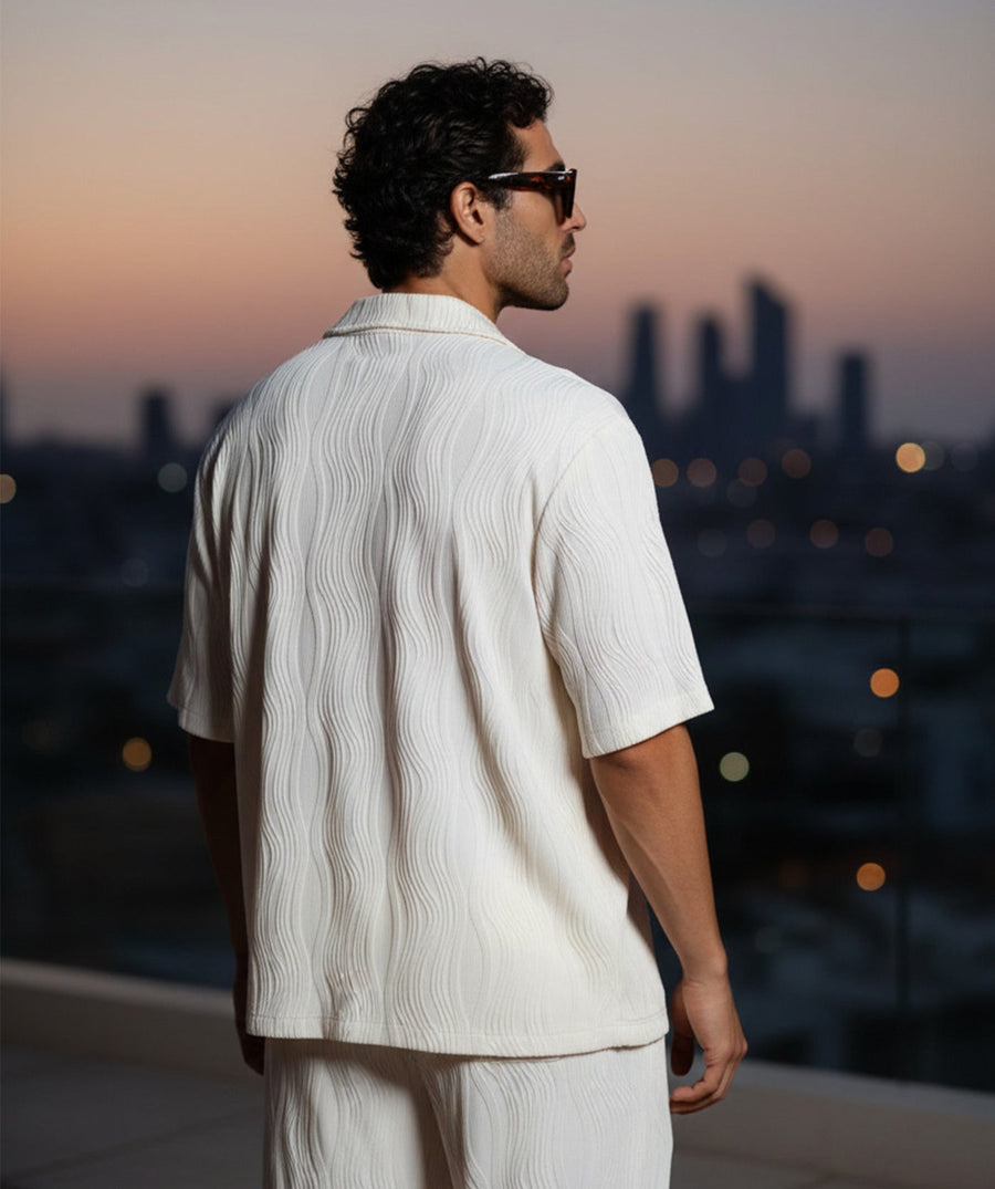 Lightweight 3D-wave textured matching set with relaxed shirt, pockets, and elastic-waist pants. Perfect for travel, beach days, lounging, or warm-weather style.