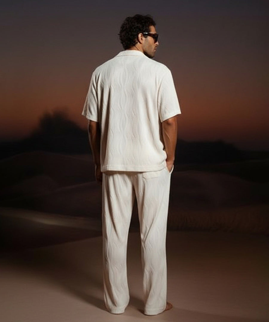 Lightweight 3D-wave textured matching set with relaxed shirt, pockets, and elastic-waist pants. Perfect for travel, beach days, lounging, or warm-weather style.